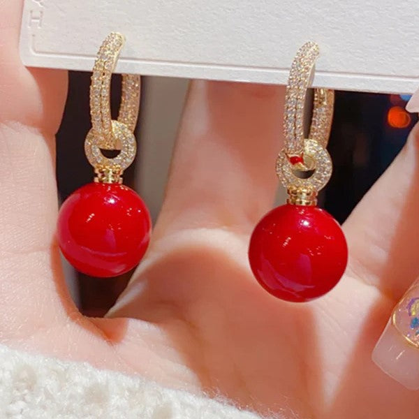 Pavé hoepel oorbellen met bol hangers