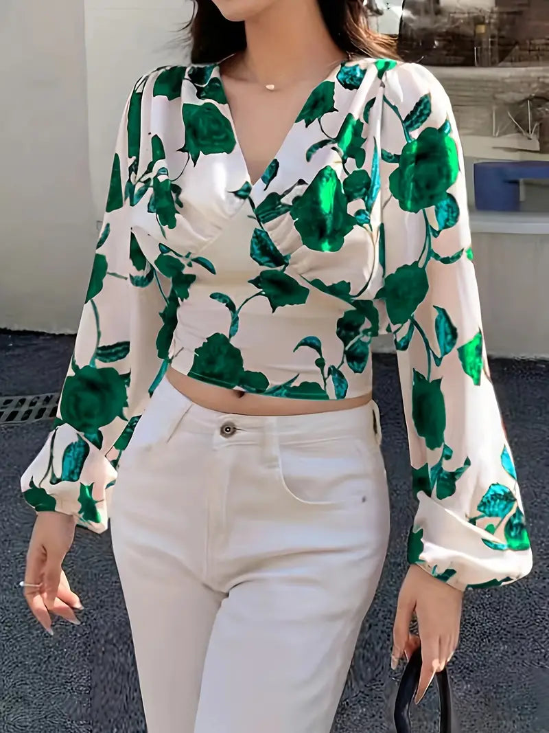 Gesneden blouse met V-hals en strik op de rug met rozenprint