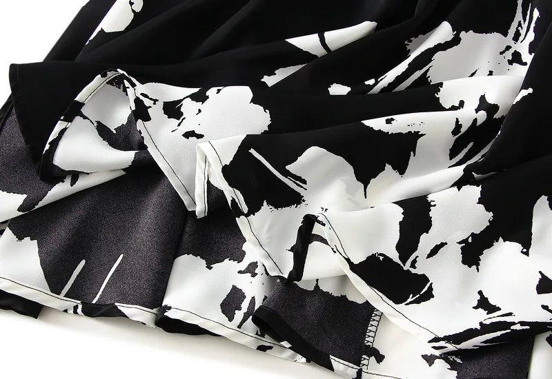 Lange plooirok met boomtakkenprint