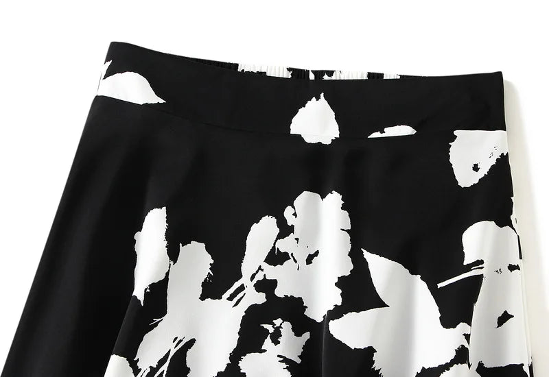 Lange plooirok met boomtakkenprint