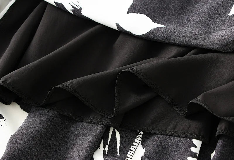 Lange plooirok met boomtakkenprint