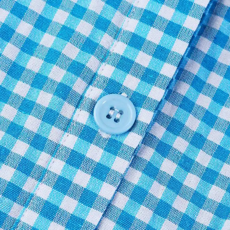 Geruite overhemdjurk met gestreepte rok en riem