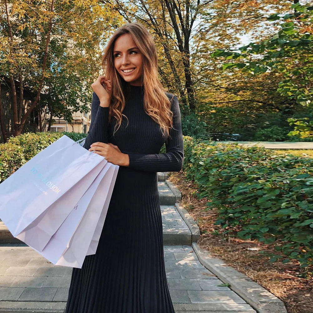 Ribgebreide midi-jurk met uitlopende zoom