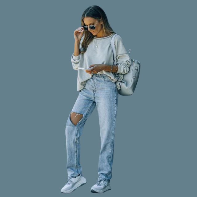 Hoog getailleerde jeans met distressed detail