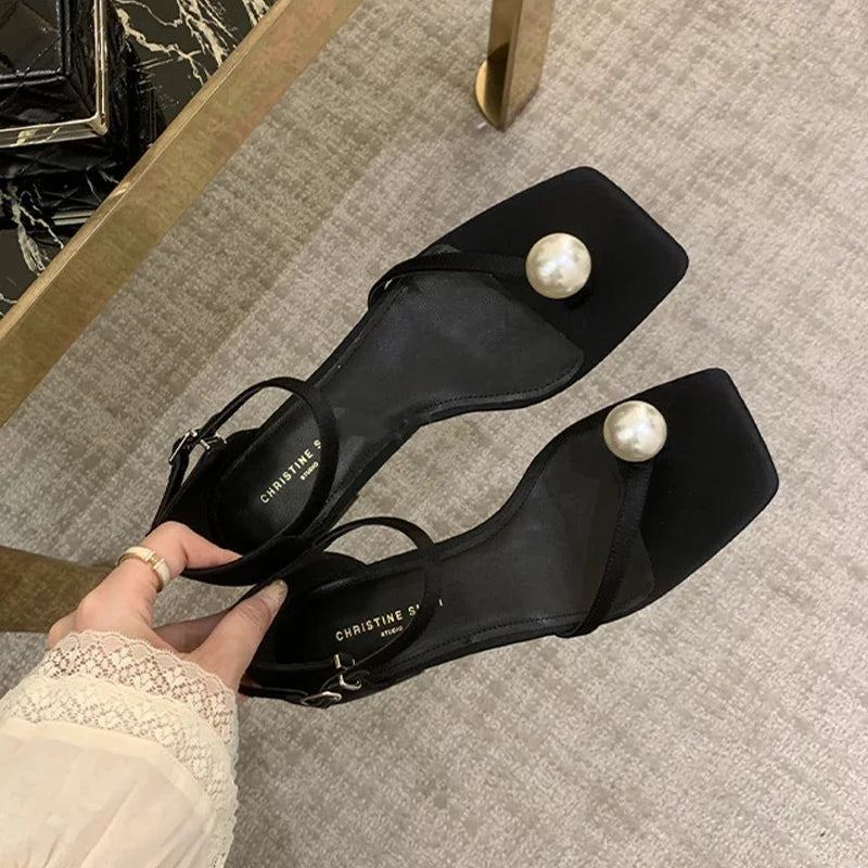 Platte sandalen met parelmoer