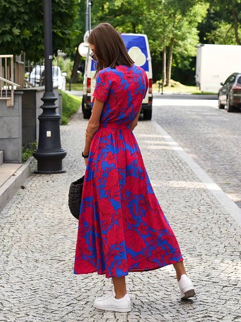 Gebloemde splitjurk met strik in taille