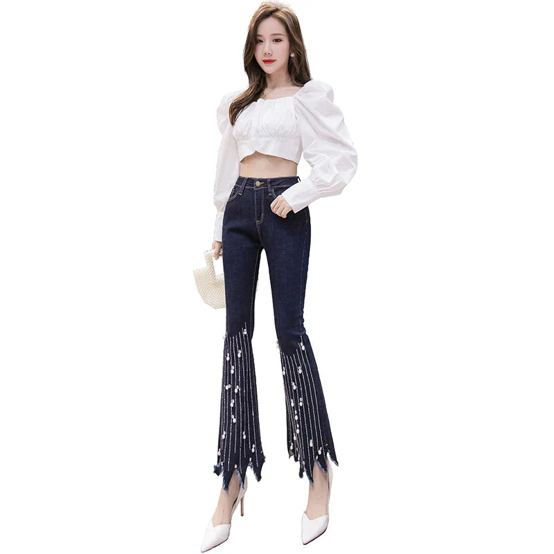 Flare jeans met hoge taille en parelmoeren kwastjesdetail