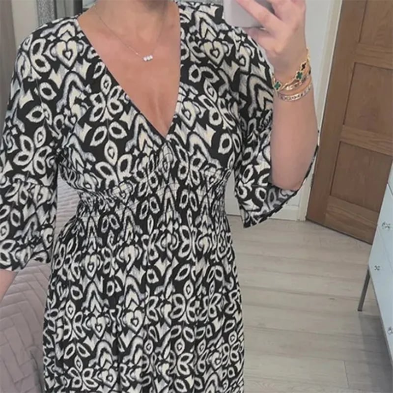 Lange damesjurk met V-hals en bloemenprint