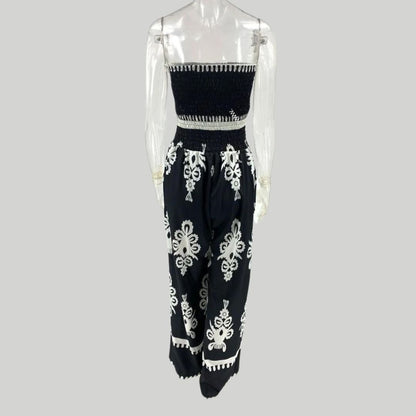 Off-the-shoulder jumpsuit met borduuraccenten