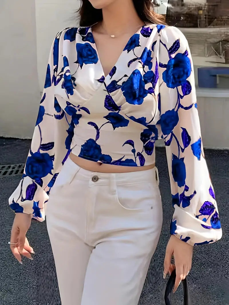 Gesneden blouse met V-hals en strik op de rug met rozenprint