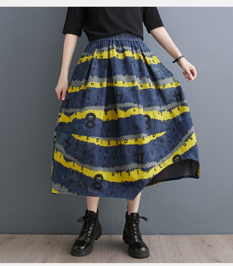 Damesrok met letterprint en asymmetrische zoom