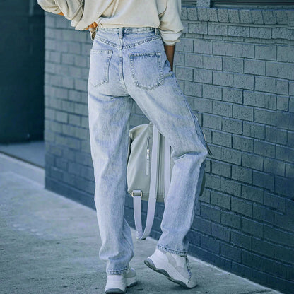 Hoog getailleerde jeans met distressed detail