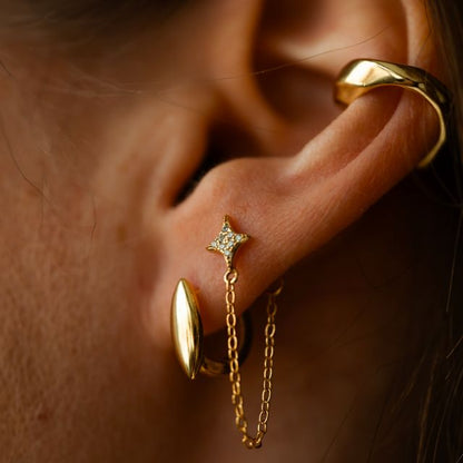 Oorbel met kwastjesketting en steraccent