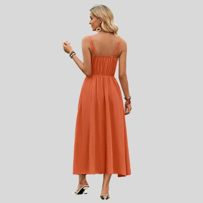 Mouwloze midi-jurk met knoopdetail aan de voorkant