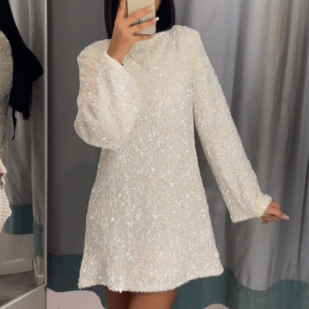 Elegante paillettenjurk met lange mouwen en strik