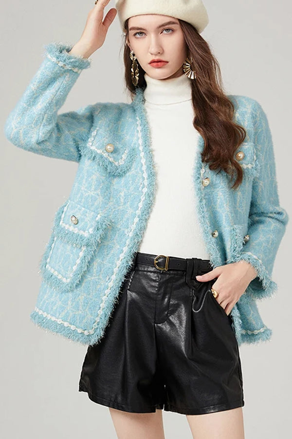 Gebreid vest in lichtblauw tweed